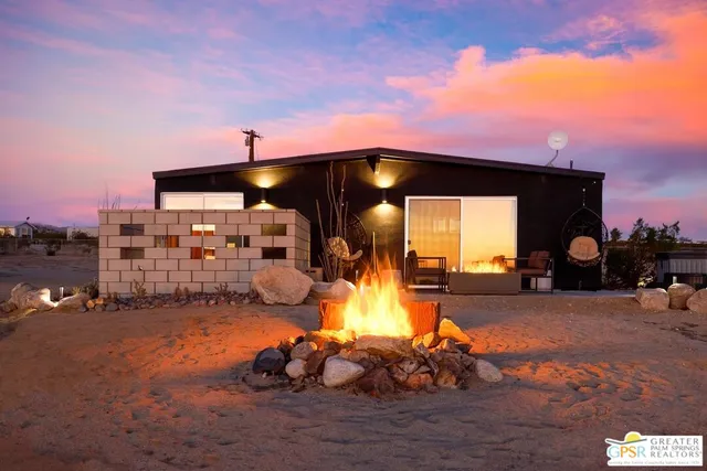 a terrace with a bench and lake view