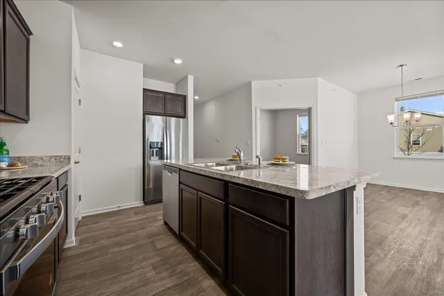 a kitchen with a sink and a refrigerator