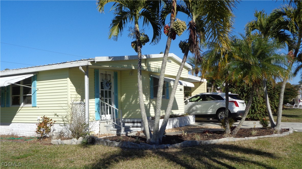 7696 Helen Road Bokeelia, FL 33922 - Photo 11 of 45 a view of a house with a patio