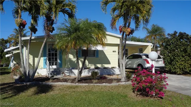 a front view of house with yard and green space