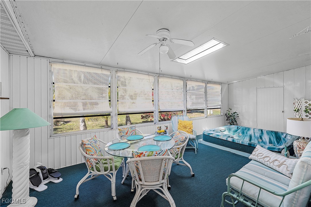 7696 Helen Road Bokeelia, FL 33922 - Photo 29 of 45 a view of a dining room with furniture window and outside view