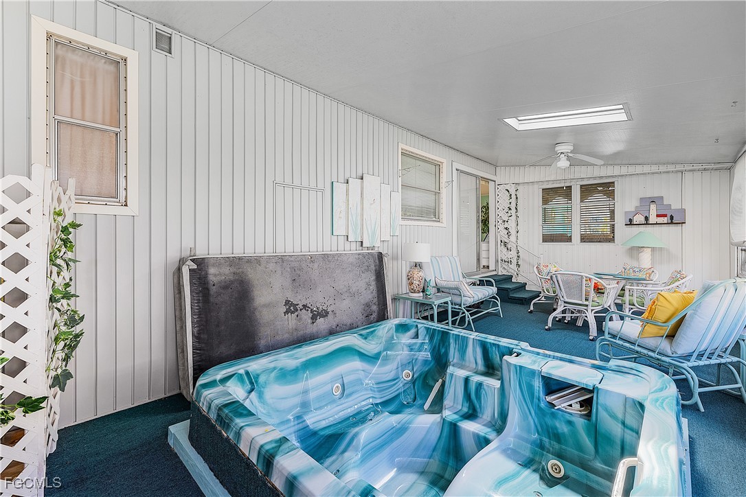 7696 Helen Road Bokeelia, FL 33922 - Photo 31 of 45 a living room with furniture and wooden floor