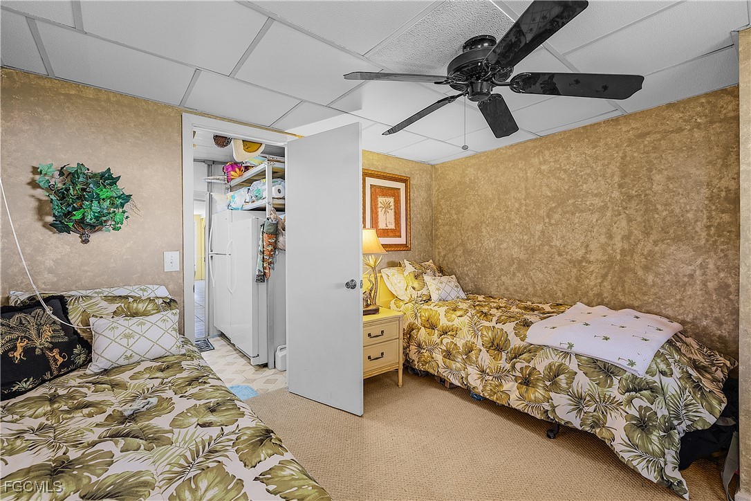 7696 Helen Road Bokeelia, FL 33922 - Photo 36 of 45 a bedroom with a bed and a window