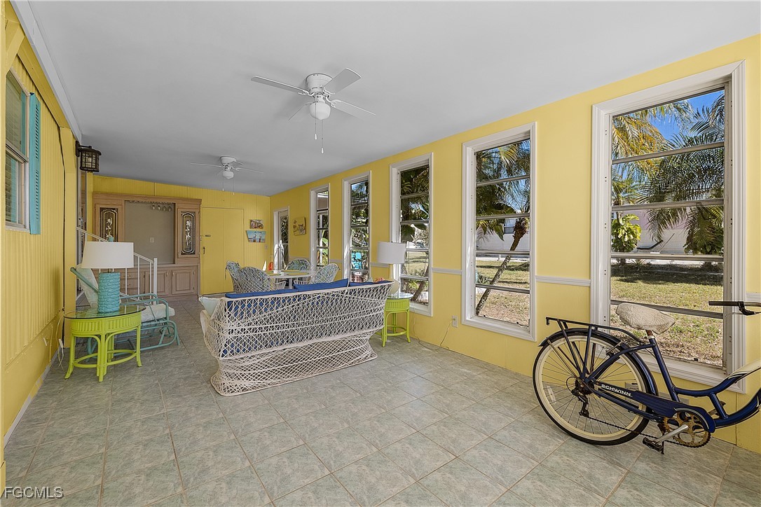 7696 Helen Road Bokeelia, FL 33922 - Photo 37 of 45 a view of a livingroom with furniture staircase and a large window