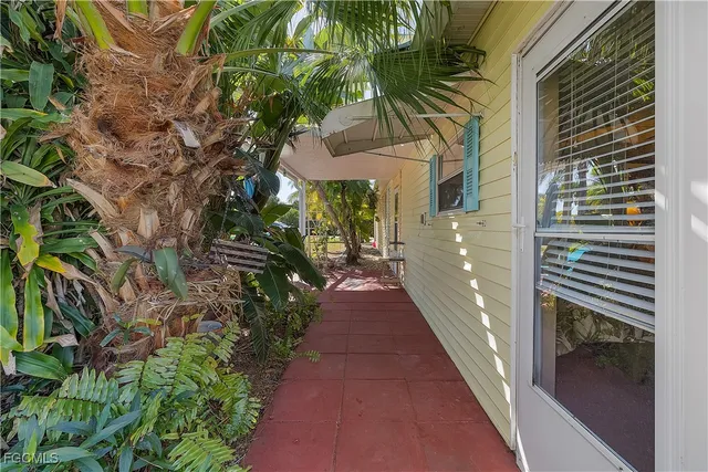 a view of a pathway both side of house