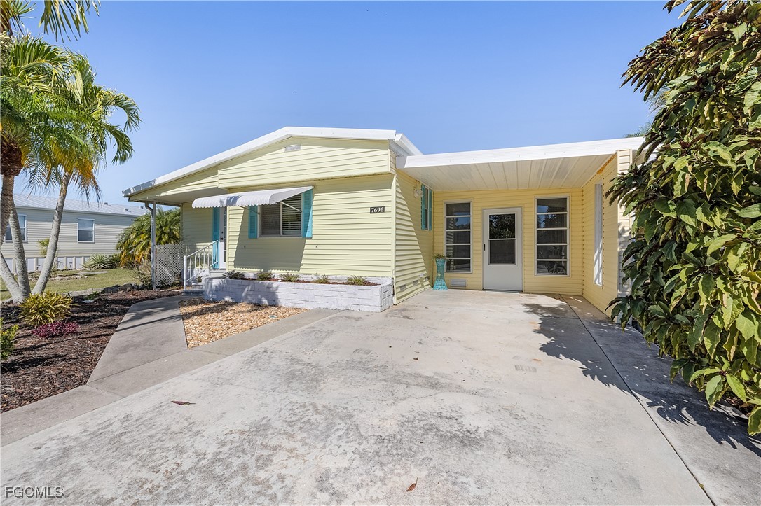 7696 Helen Road Bokeelia, FL 33922 - Photo 4 of 45 a view of a house with a patio