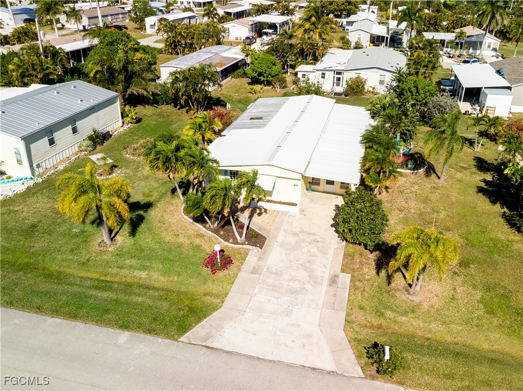7696 Helen Road Bokeelia, FL 33922 - Photo 43 of 45 an aerial view of a house with a yard basket ball court