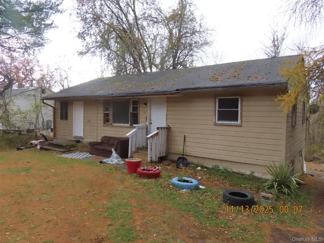 a view of a backyard with plants and a patio