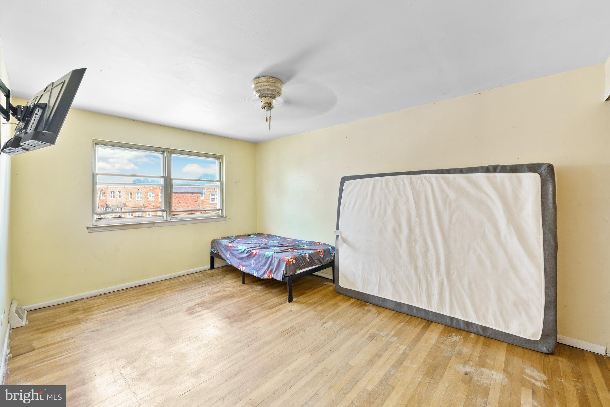 12718 Elnora Road Philadelphia, PA 19154 - Photo 16 of 25 a living room with a bed furniture and a window