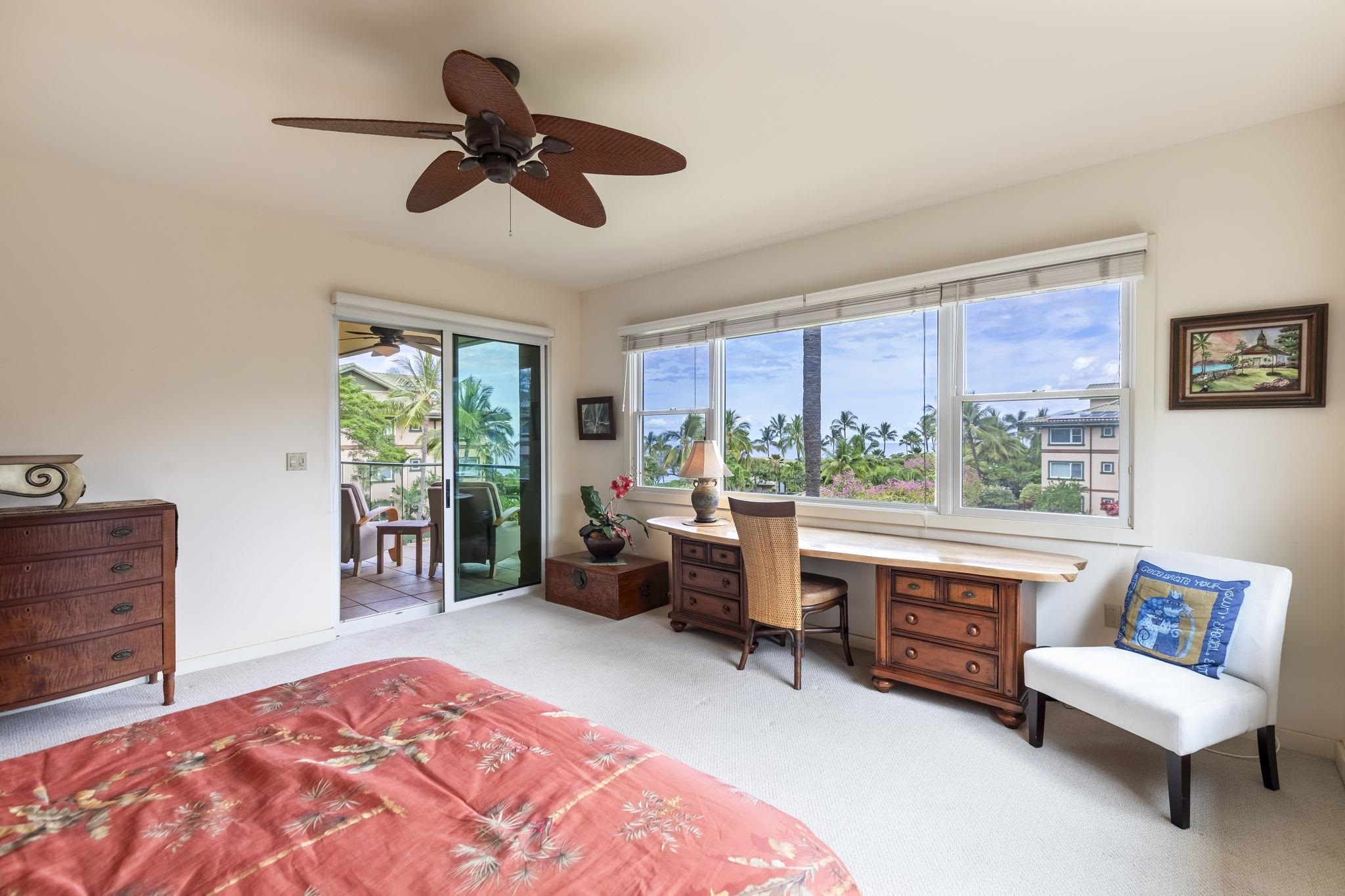 4955 Makena Road, Unit C302 Kihei, HI 96753 - Photo 12 of 37 a living room with furniture and a large window