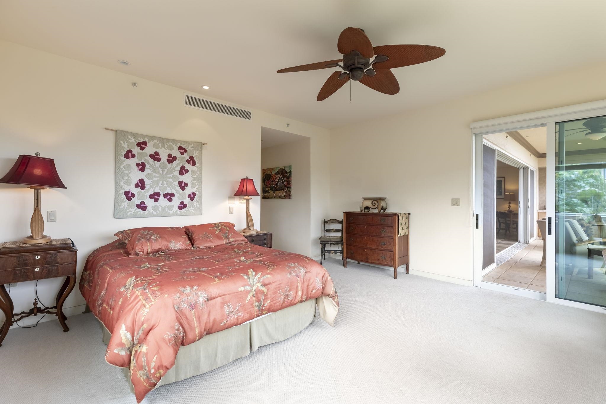 4955 Makena Road, Unit C302 Kihei, HI 96753 - Photo 14 of 37 a bedroom with a bed dresser and a chandelier