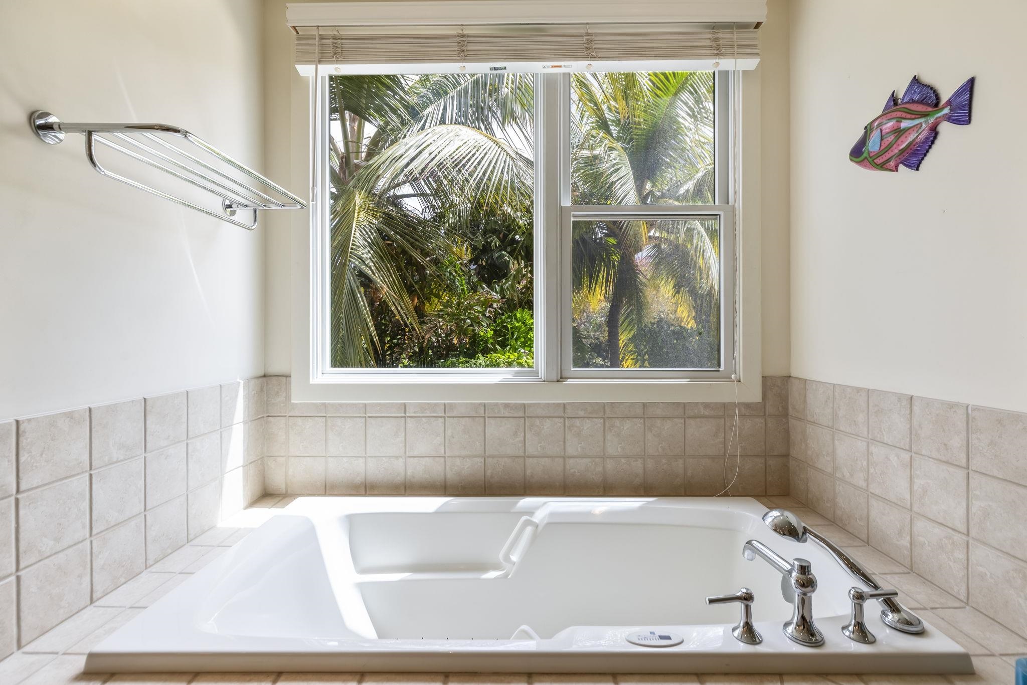 4955 Makena Road, Unit C302 Kihei, HI 96753 - Photo 15 of 37 a bath tub sitting in a bathroom next to a window