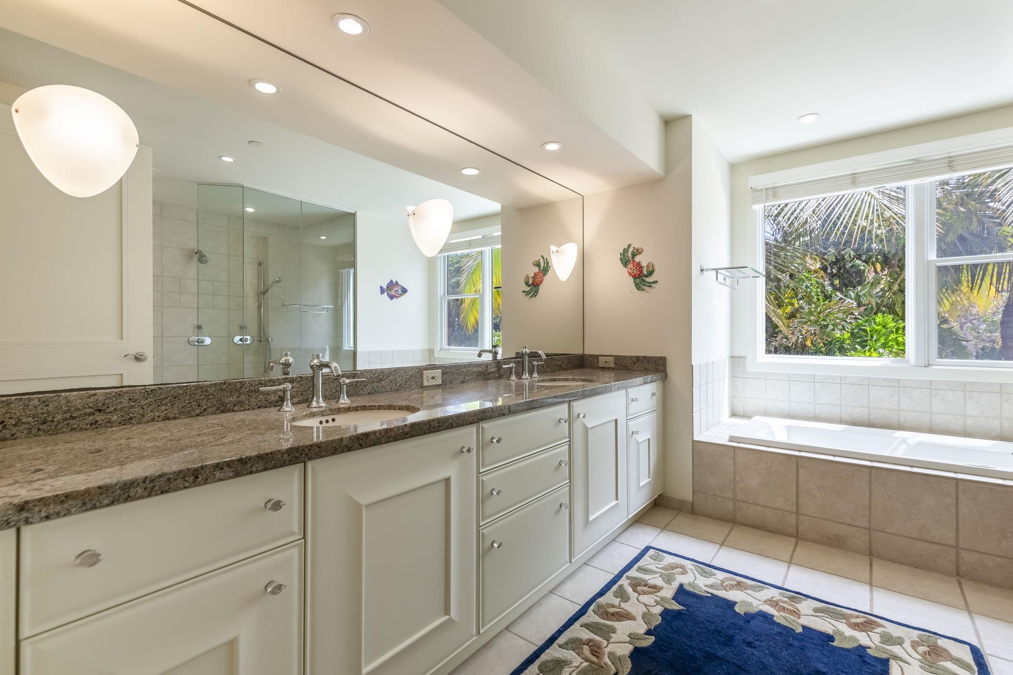 4955 Makena Road, Unit C302 Kihei, HI 96753 - Photo 16 of 37 a bathroom with a granite countertop sink mirror and double