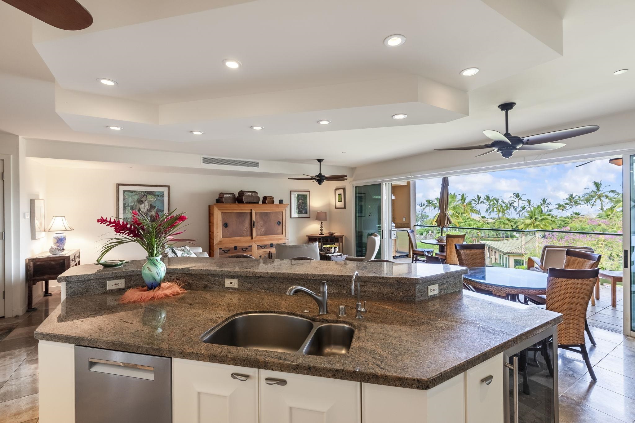 4955 Makena Road, Unit C302 Kihei, HI 96753 - Photo 2 of 37 a view of kitchen island a sink and living room