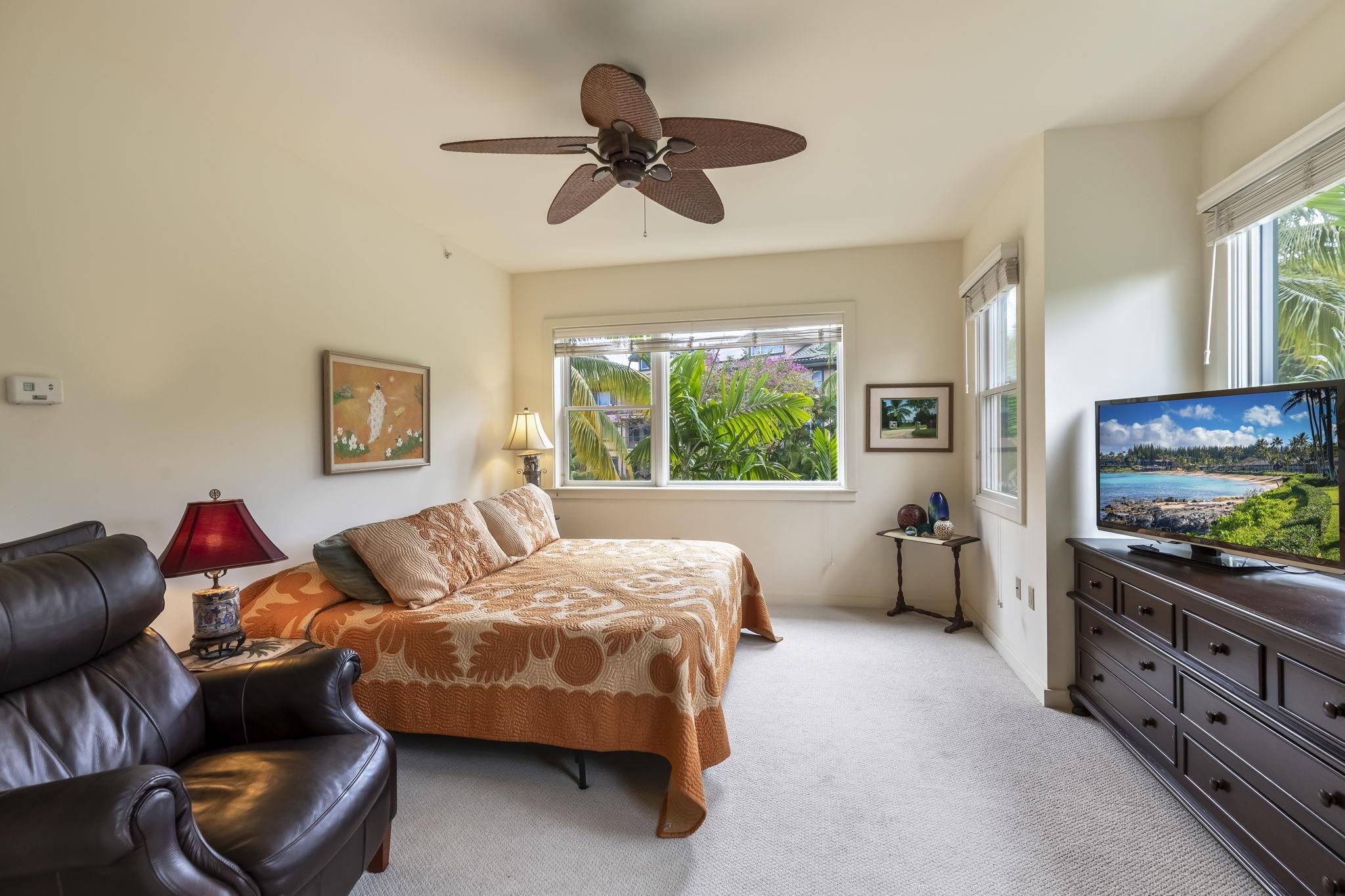 4955 Makena Road, Unit C302 Kihei, HI 96753 - Photo 21 of 37 a bed room with a bed and a television