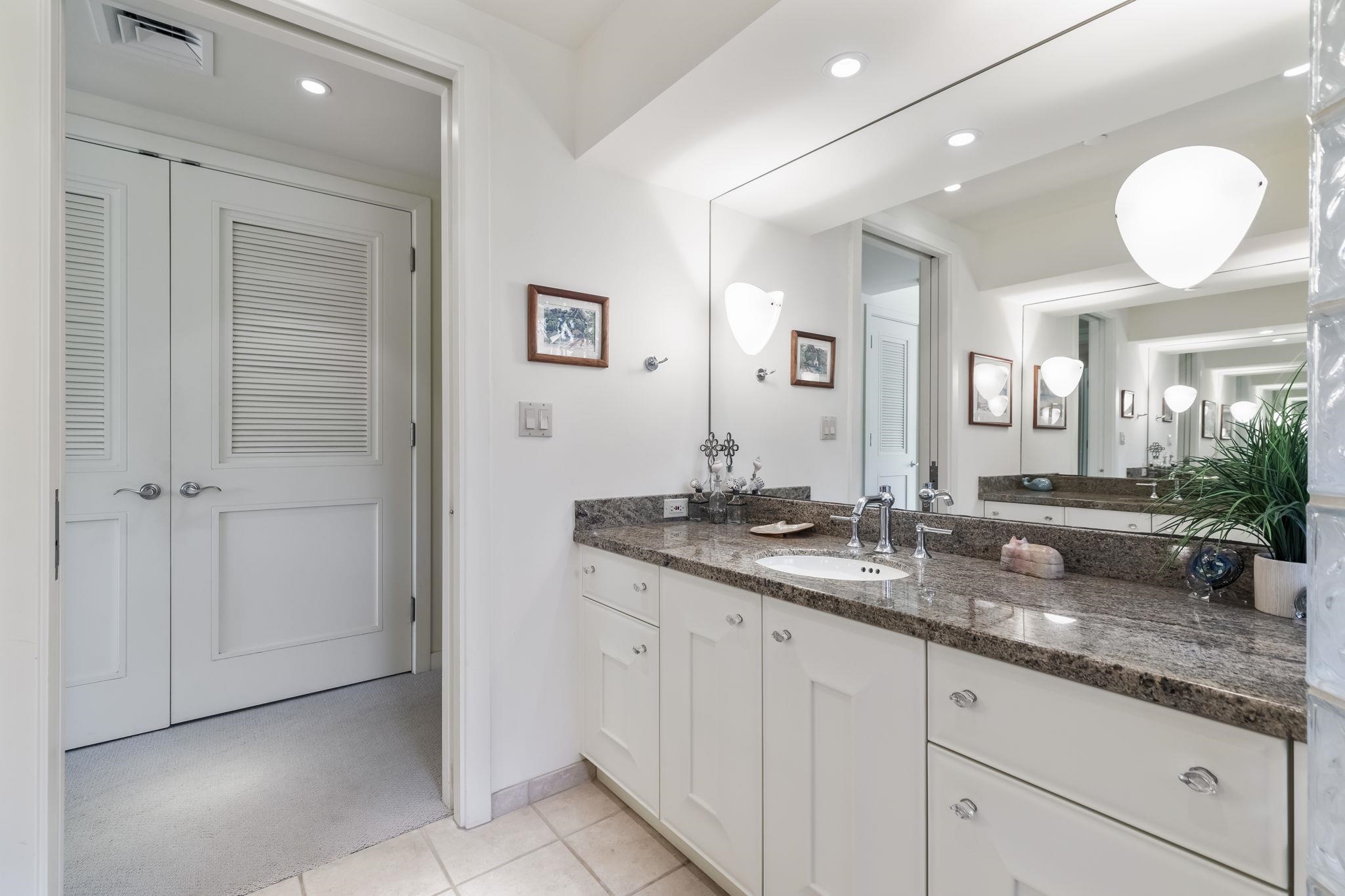 4955 Makena Road, Unit C302 Kihei, HI 96753 - Photo 24 of 37 a bathroom with double sink and a mirror