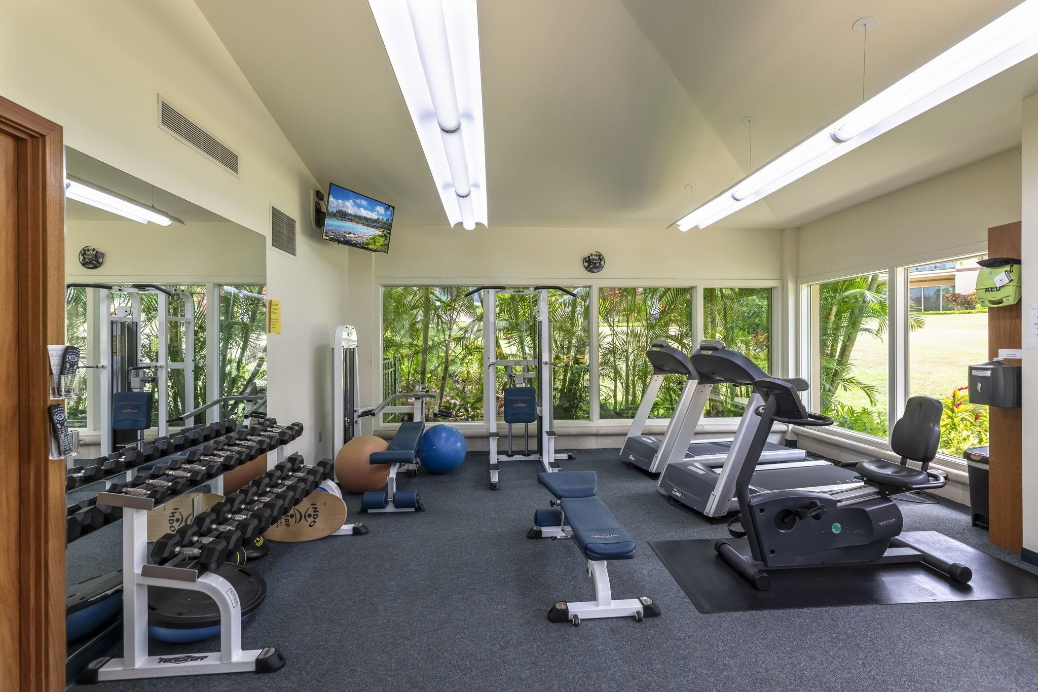 4955 Makena Road, Unit C302 Kihei, HI 96753 - Photo 34 of 37 a room with gym equipment and large windows
