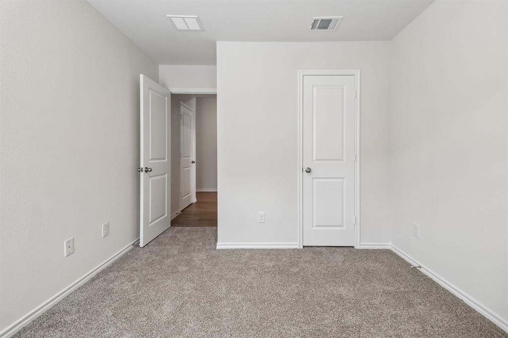1453 Millstead Rill Road Caddo Mills, TX 75135 - Photo 24 of 40 Carpeted interior room with white walls and trim