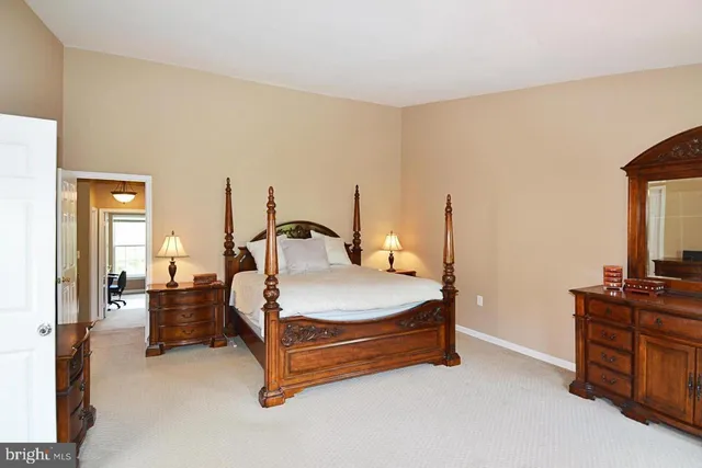 a bathroom with a double vanity sink mirror and tub