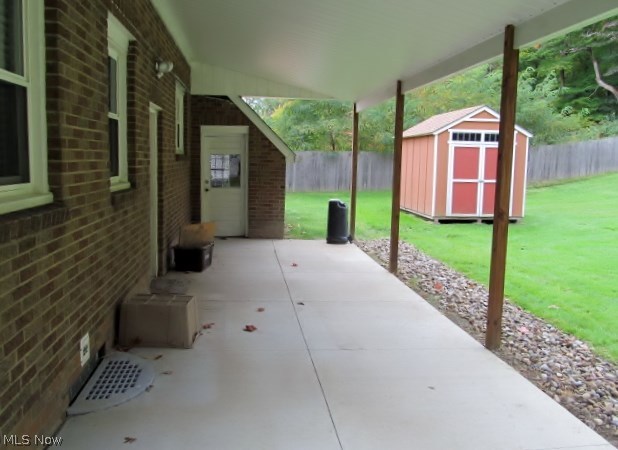 153 North Thomas Road Tallmadge, OH 44278 - Photo 20 of 21 Patio. Rear Entry to Attached Garage. Shed.