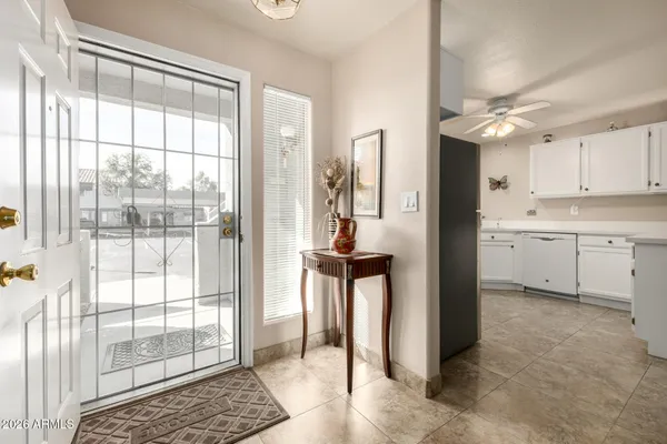 a kitchen with kitchen island a sink a stove and a refrigerator