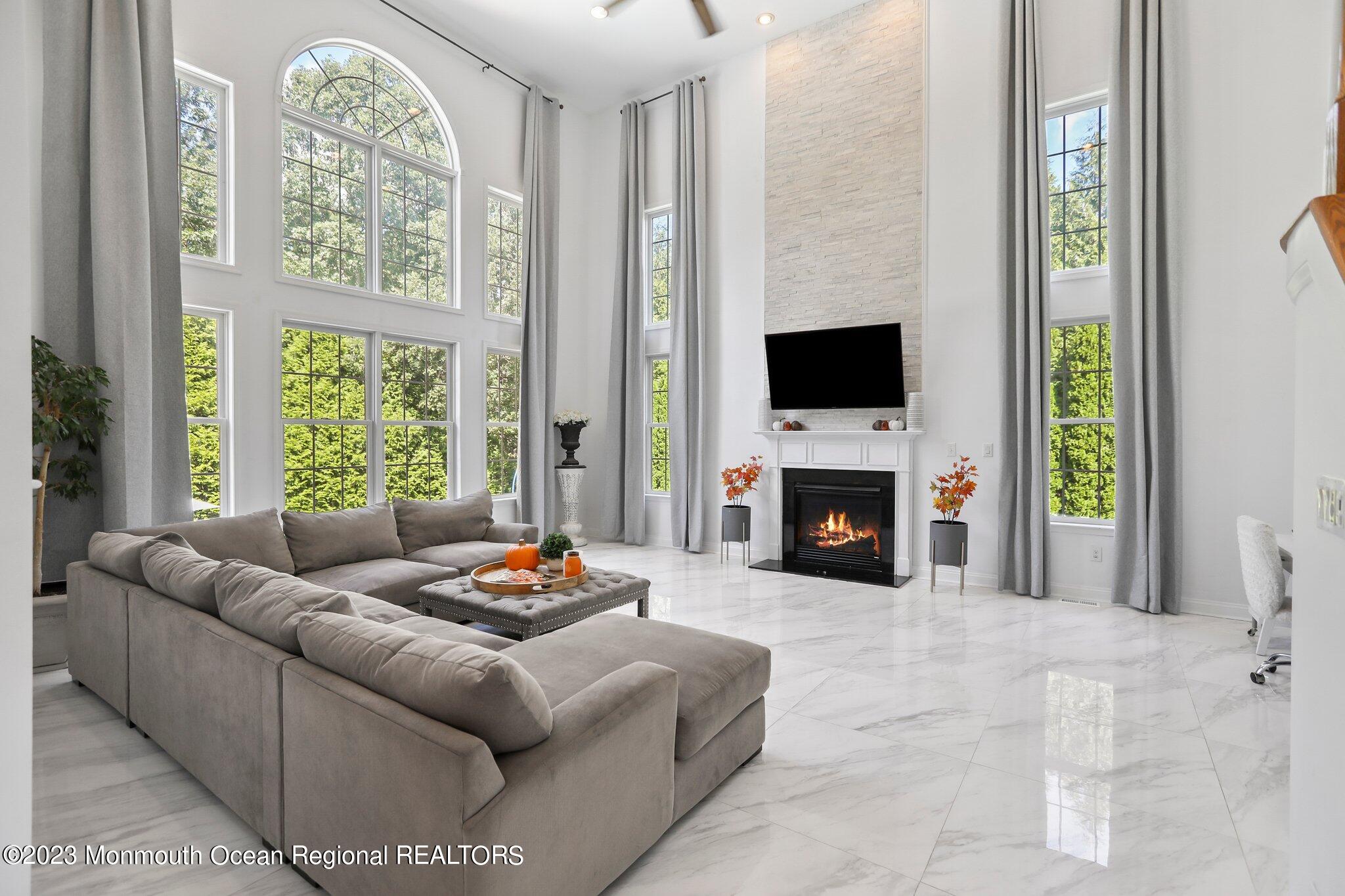 a living room with furniture and a fireplace