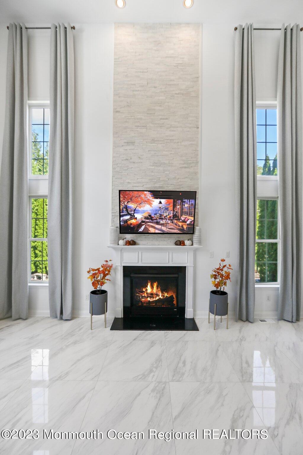 2 Wilson Boulevard Jackson, NJ 08527 - Photo 18 of 41 a living room with furniture and a fireplace