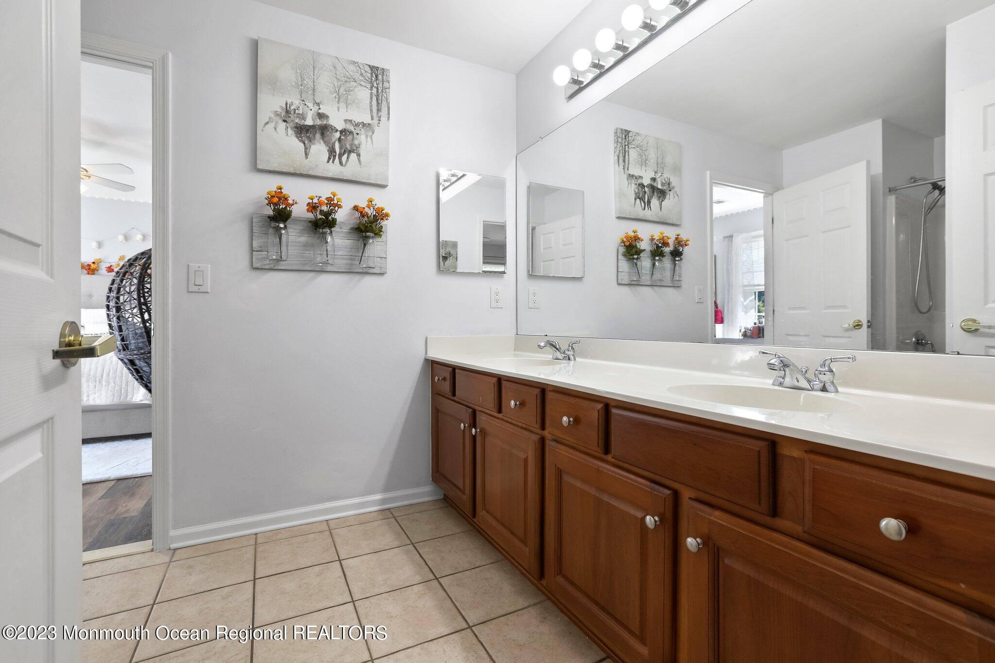 2 Wilson Boulevard Jackson, NJ 08527 - Photo 32 of 41 a spacious bathroom with a double vanity sink and a mirror