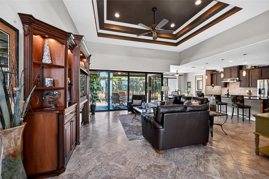 8 Windward Road Placida, FL 33946 - Photo 11 of 47 a living room with lots of furniture and a chandelier