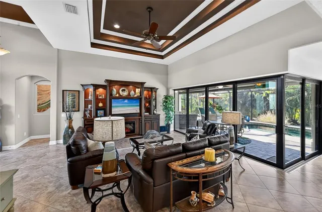 a living room with fireplace furniture and a flat screen tv