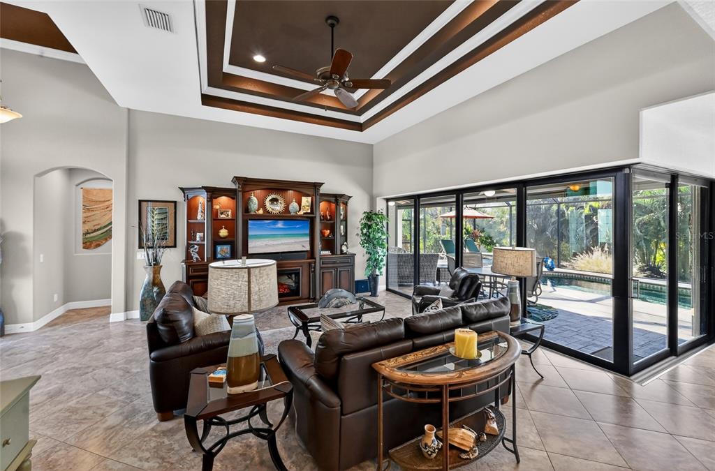 8 Windward Road Placida, FL 33946 - Photo 12 of 47 a living room with fireplace furniture and a flat screen tv
