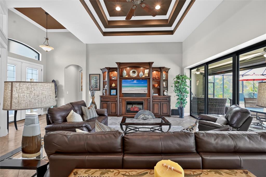 8 Windward Road Placida, FL 33946 - Photo 19 of 47 a living room with furniture and a floor to ceiling window
