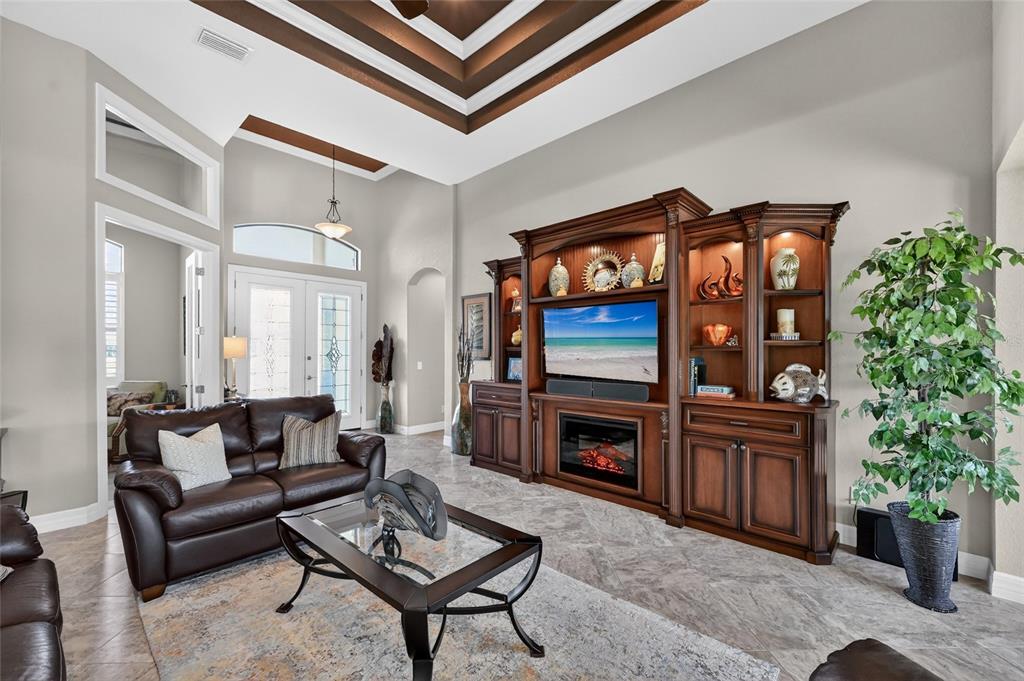 8 Windward Road Placida, FL 33946 - Photo 20 of 47 a living room with furniture a fireplace and a potted plant