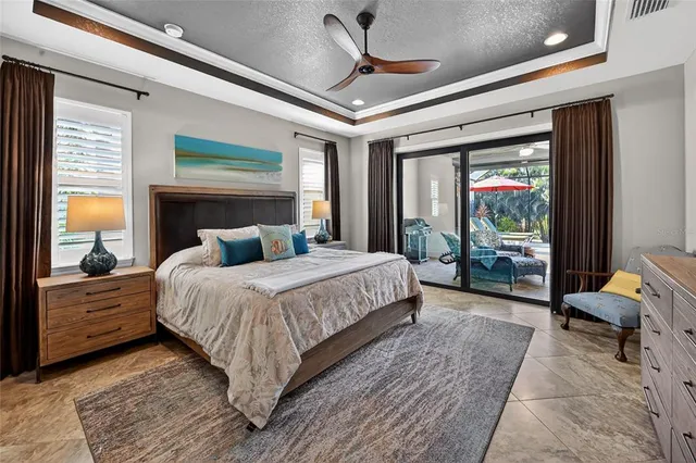 a bedroom with a large bed and a balcony