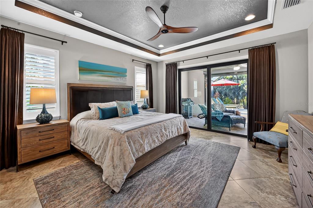 8 Windward Road Placida, FL 33946 - Photo 23 of 47 a bedroom with a large bed and a balcony