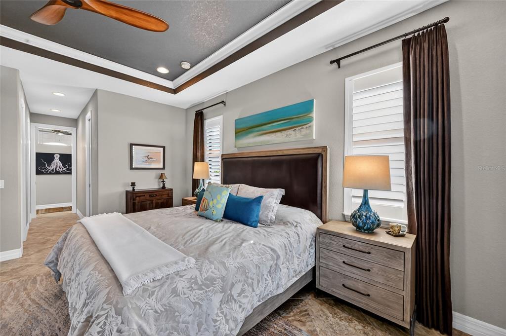 8 Windward Road Placida, FL 33946 - Photo 24 of 47 a bedroom with a bed and a mirror on dresser