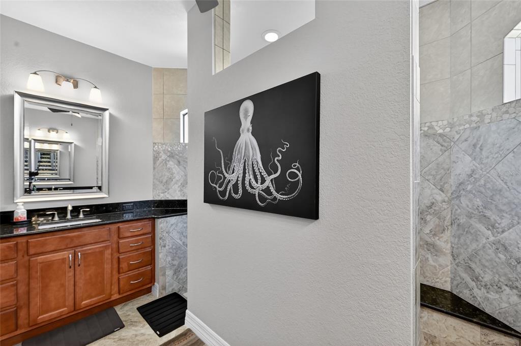 8 Windward Road Placida, FL 33946 - Photo 28 of 47 a kitchen with stainless steel appliances granite countertop a refrigerator and a stove with wooden floor
