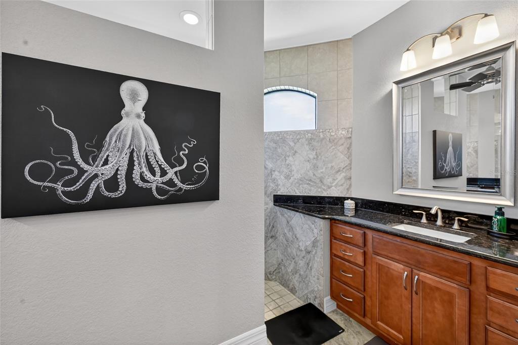 8 Windward Road Placida, FL 33946 - Photo 29 of 47 a bathroom with a sink and a mirror