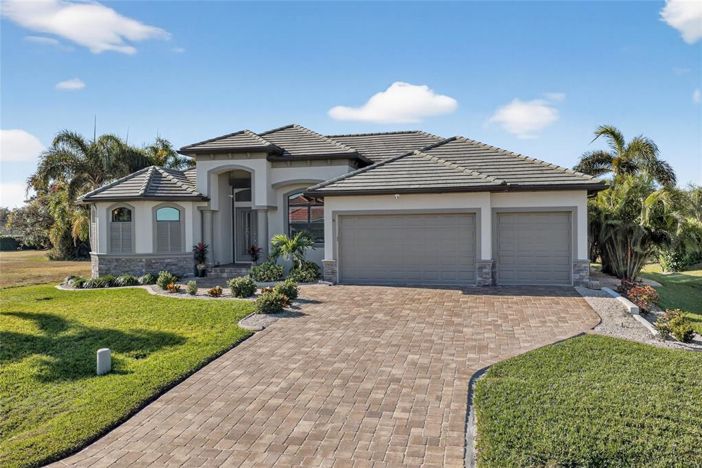 8 Windward Road Placida, FL 33946 - Photo 7 of 47 a front view of a house with a yard