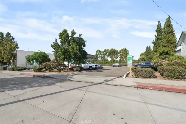 a view of car parked on the side of the road