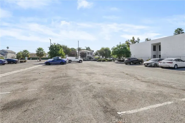 a view of street with parked cars