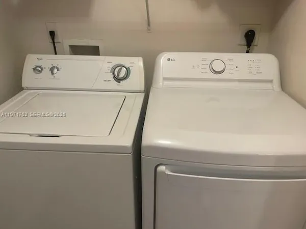 a utility room with dryer and washer