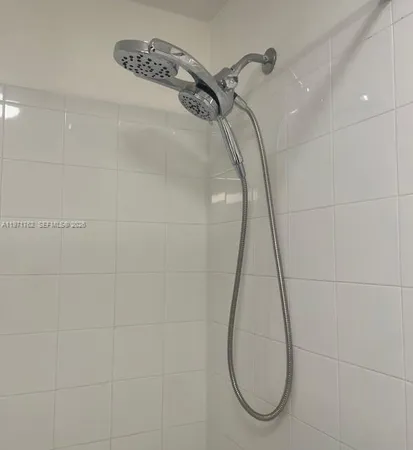 a bathroom with a glass shower door