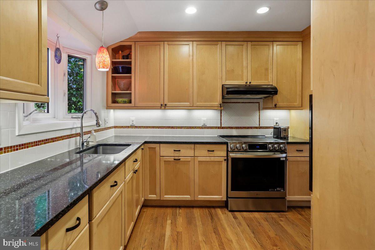 1703 Tilton Drive Silver Spring, MD 20902 - Photo 10 of 39 Modern kitchen with warm wood tones.