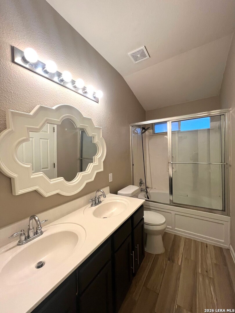 5502 Christina Path San Antonio, TX 78247 - Photo 11 of 18 a bathroom with a double vanity sink mirror and toilet