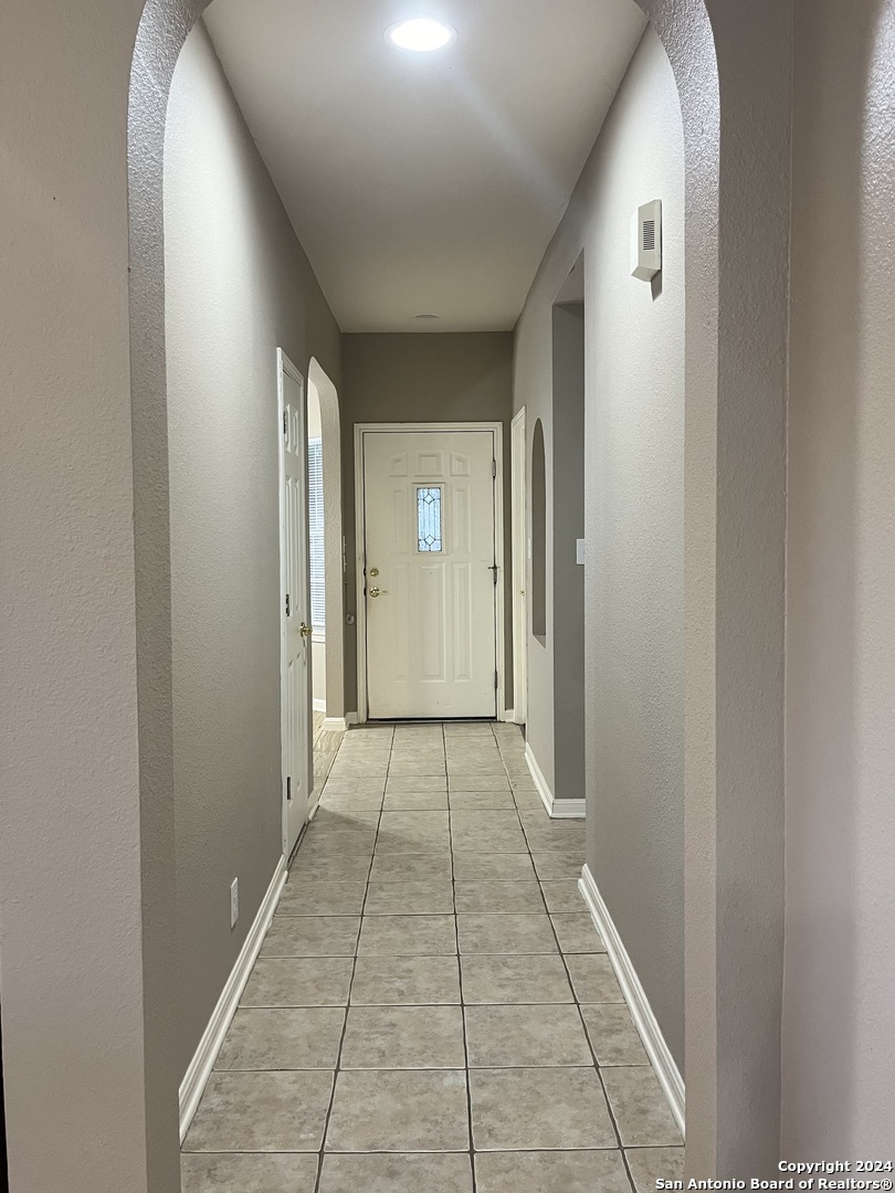 5502 Christina Path San Antonio, TX 78247 - Photo 2 of 18 a view of a room with door and stairs