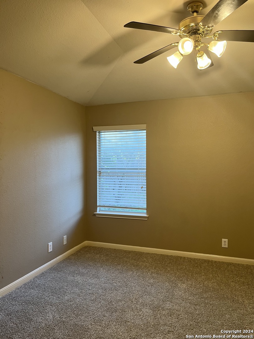 5502 Christina Path San Antonio, TX 78247 - Photo 9 of 18 a view of an empty room with a window