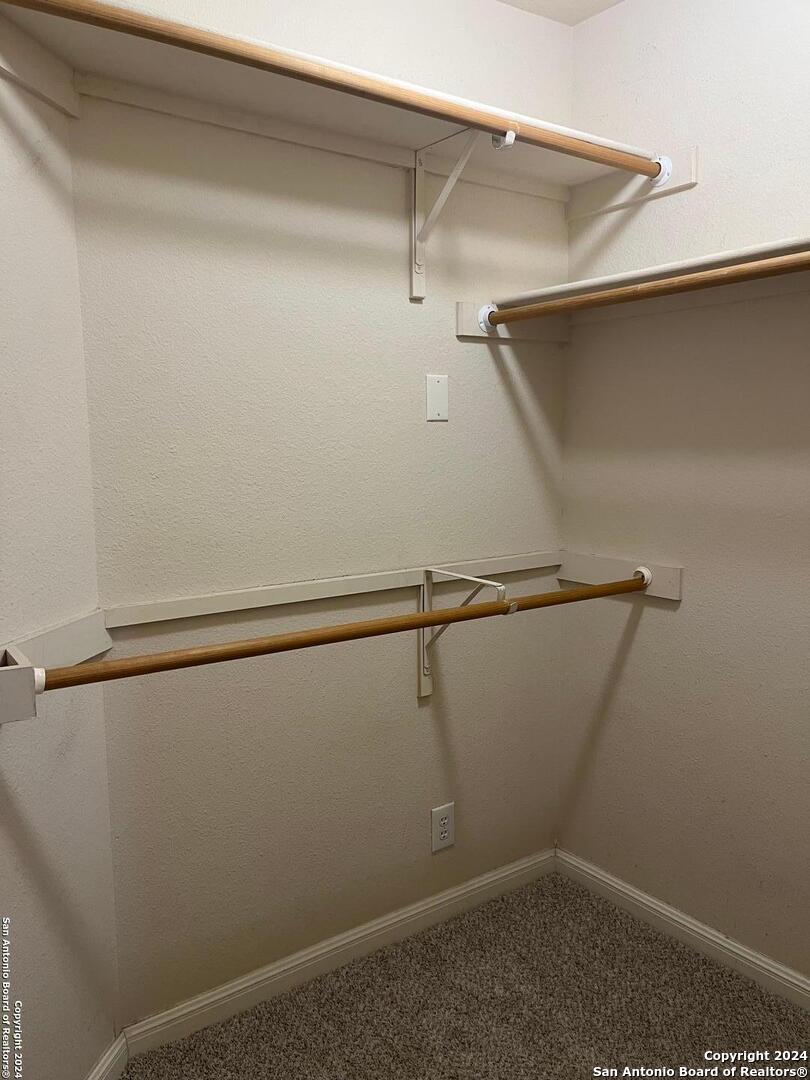 5502 Christina Path San Antonio, TX 78247 - Photo 10 of 18 a view of a room with racks on the wall