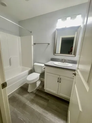 a bathroom with a toilet a sink and bathtub