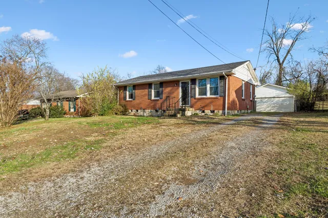 a front view of house with yard